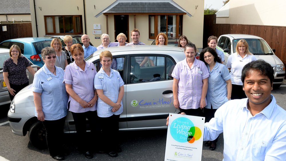 living wage care in hand